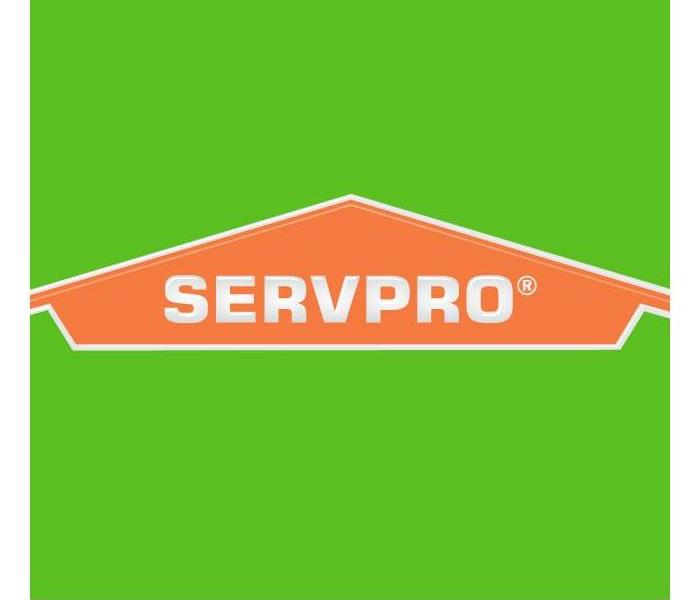 Orange logo of Servpro, that looks like a roof top.
